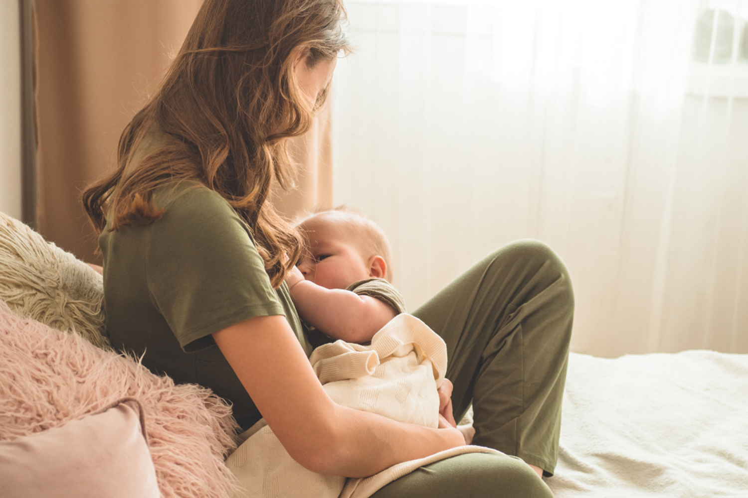 woman breastfeeding baby - lactation consultant service